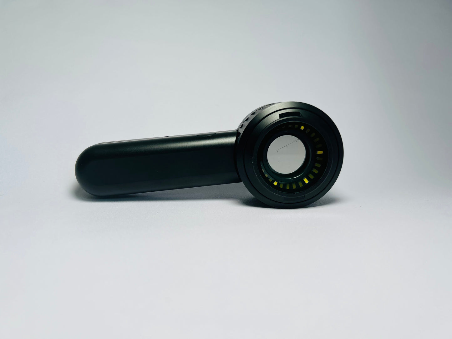 SkinLens dermatoscope — medical-grade optical lens, side profile