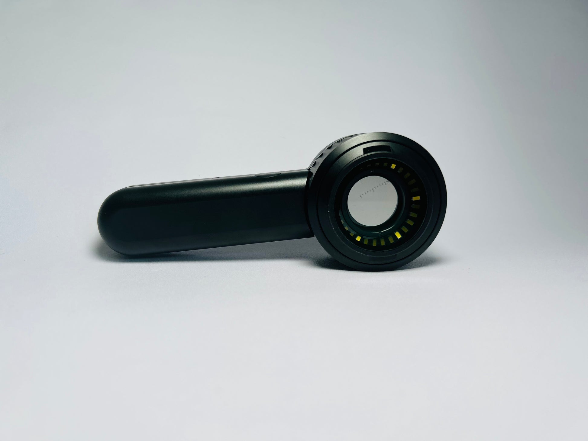 SkinLens dermatoscope — medical-grade optical lens, side profile