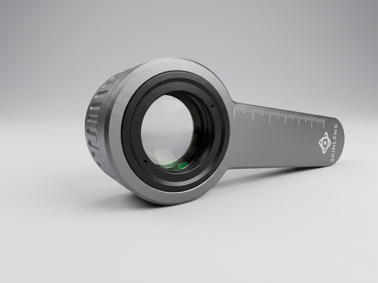 SkinLens Pro dermatoscope — three-quarter view showing optical glass lens and measurement scale